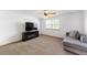 Cozy bedroom with neutral carpet, ceiling fan and a large window at 13180 Jasmine St, Thornton, CO 80602