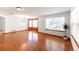 Bright dining room with hardwood floors, large windows, and plenty of space for Gathering gatherings at 13180 Jasmine St, Thornton, CO 80602