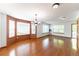Bright dining room with hardwood floors, large windows, and plenty of space for Gathering gatherings at 13180 Jasmine St, Thornton, CO 80602