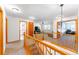 Upstairs hallway with wood railing and views to the Gathering room and formal sitting room at 13180 Jasmine St, Thornton, CO 80602