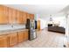 Open concept kitchen with stainless steel appliances, tile flooring, and connection to the living area at 13180 Jasmine St, Thornton, CO 80602