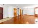Inviting living room features hardwood floors and neutral paint, creating a warm atmosphere at 13180 Jasmine St, Thornton, CO 80602