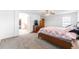 Spacious primary bedroom featuring plush carpets, access to the bathroom and closet at 13180 Jasmine St, Thornton, CO 80602