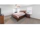 The primary bedroom features carpeted floors, a ceiling fan and ample natural light at 13180 Jasmine St, Thornton, CO 80602