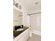 Bathroom featuring modern fixtures and a shower-tub combination at 6506 Barnstead Dr, Castle Pines, CO 80108