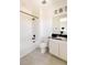 Bathroom featuring modern fixtures, shower over tub, and contrasting hardware at 6506 Barnstead Dr, Castle Pines, CO 80108