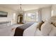 Bright main bedroom with balcony access, chandelier, and decorative mirror at 6506 Barnstead Dr, Castle Pines, CO 80108