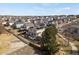 This aerial shot showcases a landscaped backyard, solar panels, and a home nestled in a quiet neighborhood at 3699 S Killarney St, Aurora, CO 80013