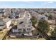 Aerial view of a home showing solar panels, a patio with furniture, and a fenced yard in a residential area at 3699 S Killarney St, Aurora, CO 80013