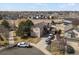 Aerial view of a two-story home with a well-maintained yard and a three car driveway at 3699 S Killarney St, Aurora, CO 80013