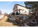 Multi-tiered backyard showcasing creative landscaping and ample space for gardening or play at 3699 S Killarney St, Aurora, CO 80013