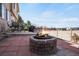 The backyard patio features a stone firepit and seating, perfect for cozy evenings outdoors at 3699 S Killarney St, Aurora, CO 80013