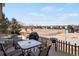 A cozy backyard patio features outdoor seating and grill, ideal for entertaining and relaxing in the sun at 3699 S Killarney St, Aurora, CO 80013