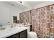 Bathroom features a sink, toilet and decorative brown and white shower curtain at 3699 S Killarney St, Aurora, CO 80013