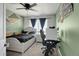 Comfortable bedroom with a neutral palette and a desk area, ideal for a home office at 3699 S Killarney St, Aurora, CO 80013
