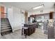 Bright kitchen with a functional center island, stainless steel appliances, and direct access to the stairs at 3699 S Killarney St, Aurora, CO 80013