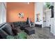 Cozy living room with a comfortable sectional sofa, bright walls, and stylish decor at 3699 S Killarney St, Aurora, CO 80013