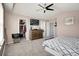 Spacious primary bedroom boasts a ceiling fan, walk-in closet, and neutral decor at 3699 S Killarney St, Aurora, CO 80013
