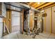 Exposed pipes and utility equipment in the basement at 8725 Meadowlark Cir, Highlands Ranch, CO 80126
