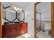 Bathroom features double sinks, ornate mirror, black granite countertops, and tile shower with glass door at 8725 Meadowlark Cir, Highlands Ranch, CO 80126