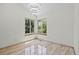 Bright bedroom with tile floors, corner windows offering natural light and green views at 8725 Meadowlark Cir, Highlands Ranch, CO 80126