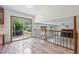 Dining area features tile floors, sliding door to deck, and stairs to living room with fireplace at 8725 Meadowlark Cir, Highlands Ranch, CO 80126