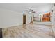 Spacious living room featuring tile floors, staircase, and ceiling fan at 8725 Meadowlark Cir, Highlands Ranch, CO 80126