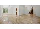 Bright living room with tile floors, modern lighting, and plenty of natural light at 8725 Meadowlark Cir, Highlands Ranch, CO 80126