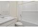 Bathroom featuring a single vanity, toilet and shower-tub combination at 770 N Deer Park St, Watkins, CO 80137