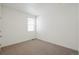 Empty, neutral bedroom with a window at 770 N Deer Park St, Watkins, CO 80137