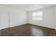 Well-lit bedroom with modern wood floors and one window at 770 N Deer Park St, Watkins, CO 80137