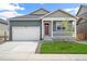 Charming single-Gathering home with a two-car garage and a cozy front porch at 770 N Deer Park St, Watkins, CO 80137