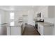 Well-lit kitchen with granite counters, stainless appliances and oversized island at 770 N Deer Park St, Watkins, CO 80137