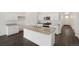 Stylish kitchen with granite counters, stainless appliances, and center island at 770 N Deer Park St, Watkins, CO 80137