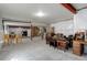 Unfinished basement with exposed walls, support beams, and furniture at 6899 Petunia Pl, Castle Rock, CO 80108