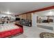 Unfinished basement area with bed, closet, and exposed walls at 6899 Petunia Pl, Castle Rock, CO 80108