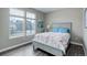 Bright bedroom features a large window and stylish decor at 6899 Petunia Pl, Castle Rock, CO 80108