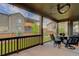 Relaxing screened-in patio with outdoor seating and backyard views at 6899 Petunia Pl, Castle Rock, CO 80108