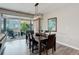 Modern dining room with backyard views through sliding glass doors, featuring a modern chandelier at 6899 Petunia Pl, Castle Rock, CO 80108