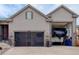 Exterior view of the attached garage that can also be used as RV storage at 6899 Petunia Pl, Castle Rock, CO 80108