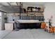 Spacious garage featuring ample storage, cabinets, workbenches and organization system at 6899 Petunia Pl, Castle Rock, CO 80108