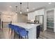 A modern kitchen features stainless steel appliances, pendant lighting and a large island at 6899 Petunia Pl, Castle Rock, CO 80108