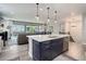 Modern kitchen featuring a large island, stainless steel appliances, and an open floor plan at 6899 Petunia Pl, Castle Rock, CO 80108