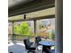 Relaxing covered patio offers comfortable seating, a grill, and a view of the backyard and neighborhood at 6899 Petunia Pl, Castle Rock, CO 80108