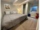 Cozy bedroom with carpet, a queen-size bed, and a closet at 3993 Haddon Rd, Denver, CO 80205