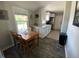 Cozy dining area with a modern kitchen featuring granite countertops and stainless steel appliances at 3993 Haddon Rd, Denver, CO 80205