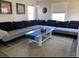 Comfortable living room with stylish decor, including a large sectional and area rug at 3993 Haddon Rd, Denver, CO 80205