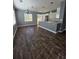 Bright dining room featuring hardwood floors, large windows and modern light fixtures at 1347 Carlyle Park Cir, Highlands Ranch, CO 80129