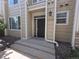Charming entryway with a black front door, stone steps and manicured landscaping at 1347 Carlyle Park Cir, Highlands Ranch, CO 80129
