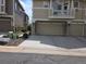 Spacious two-car garage with an attached balcony and stone accents at 1347 Carlyle Park Cir, Highlands Ranch, CO 80129